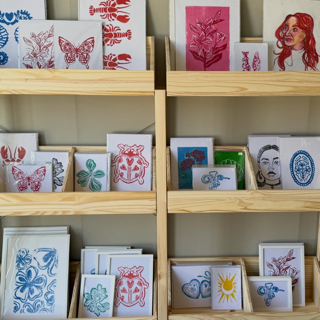 Shelves of lino prints and cards in the Leigh Marina studio shop